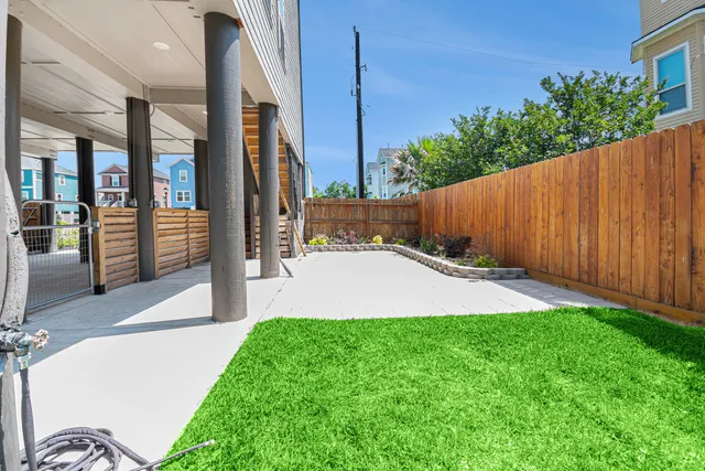 a view of a house with a big yard and potted plants