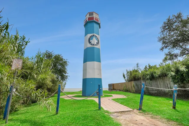 a view of a lake with boats next to a bridge