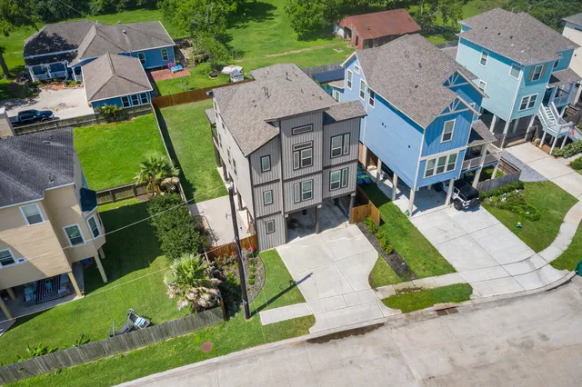 a front view of a building with a garden