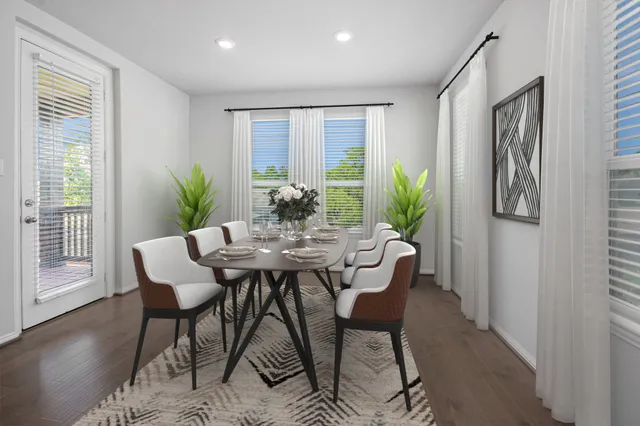 a dining room with furniture and wooden floor