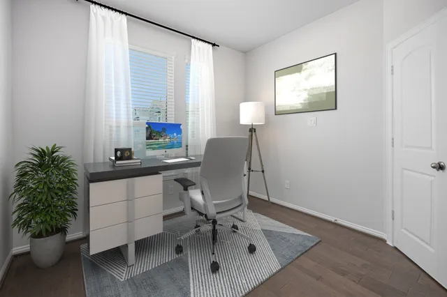 a workspace with furniture and a potted plant