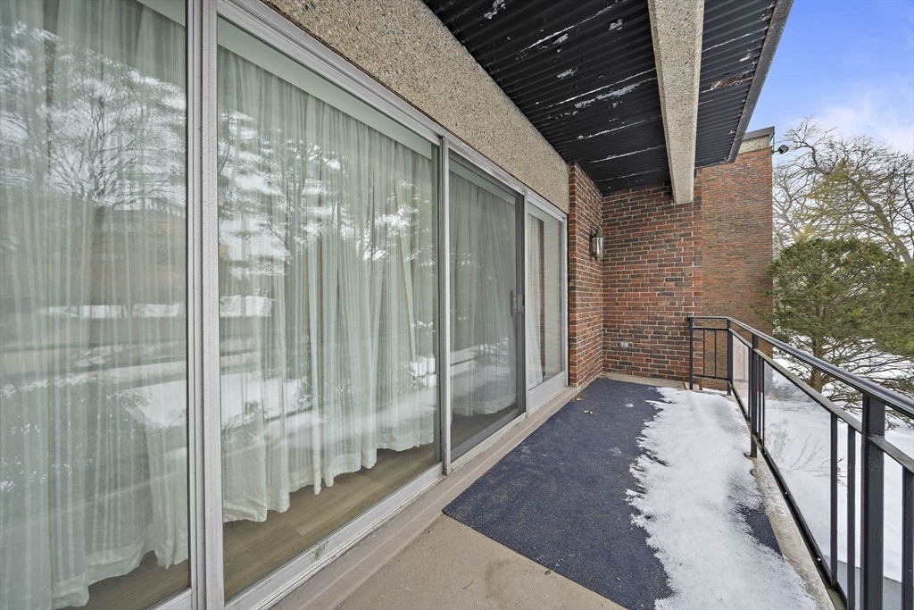 1204 Greendale Avenue, Unit 128 Needham, MA 02492 - Photo 23 of 27 a view of a balcony