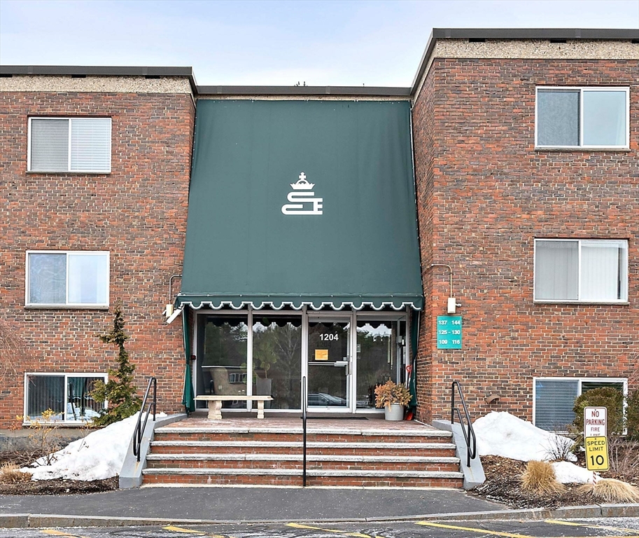 1204 Greendale Avenue, Unit 128 Needham, MA 02492 - Photo 24 of 27 a building exterior with multiple houses