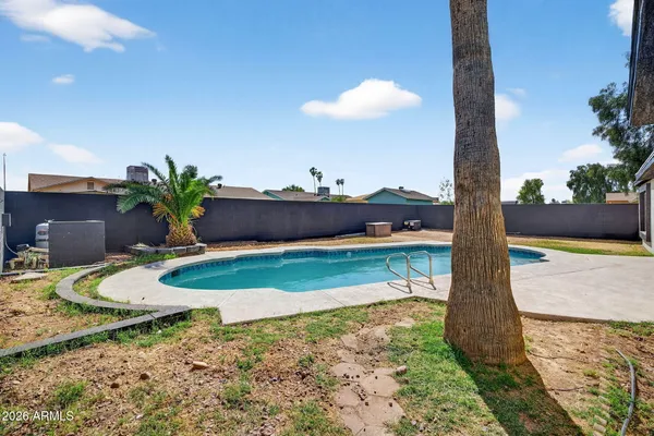a view of a house with swimming pool