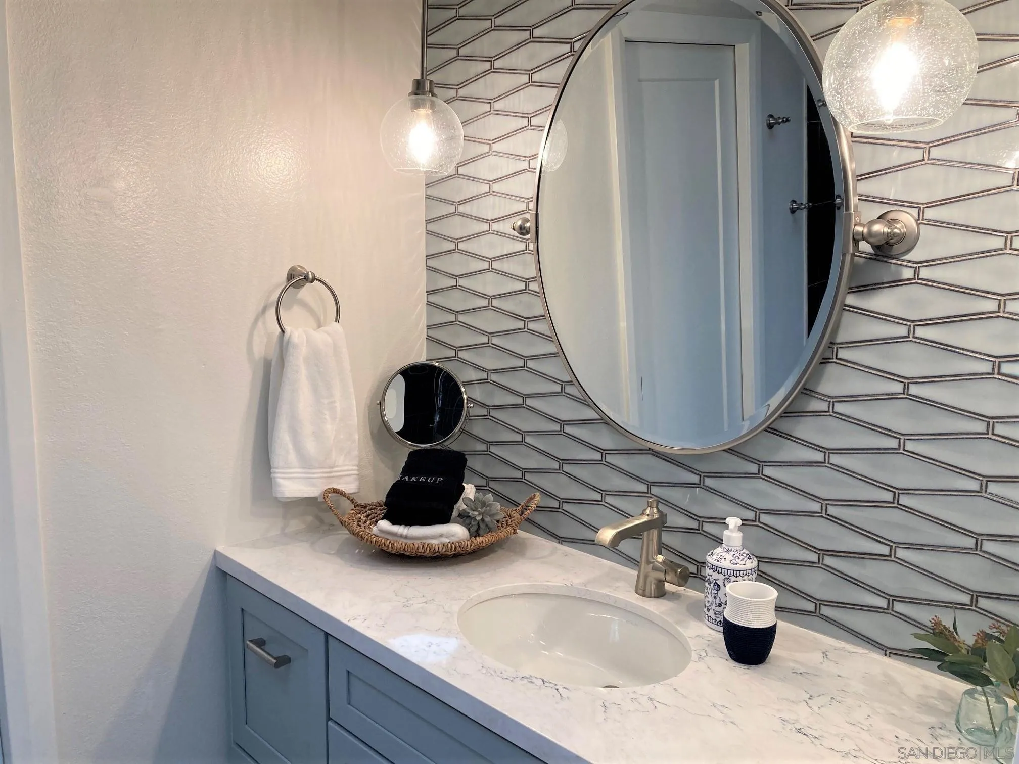 4023 Avenida Brisa Rancho Santa Fe, CA 92091 - Photo 15 of 24 a bathroom with a sink and a mirror
