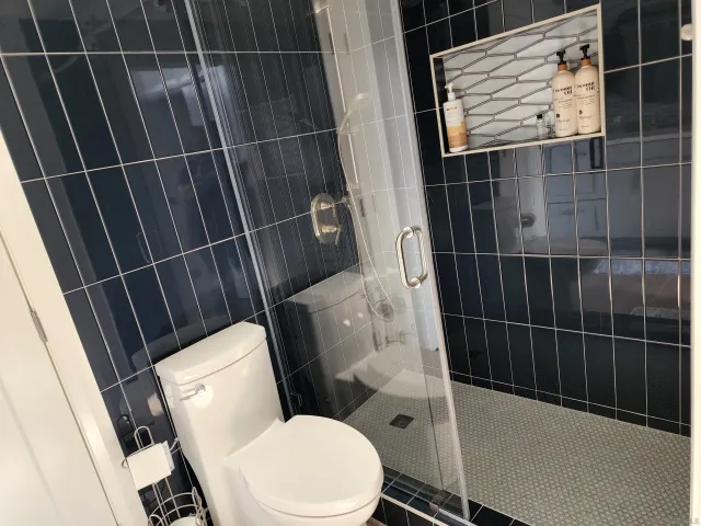 a bathroom with toilet sink and tub