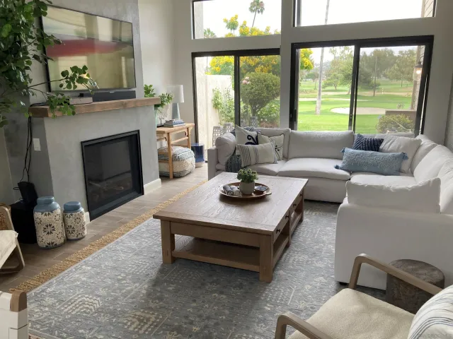 a living room with furniture and a fireplace