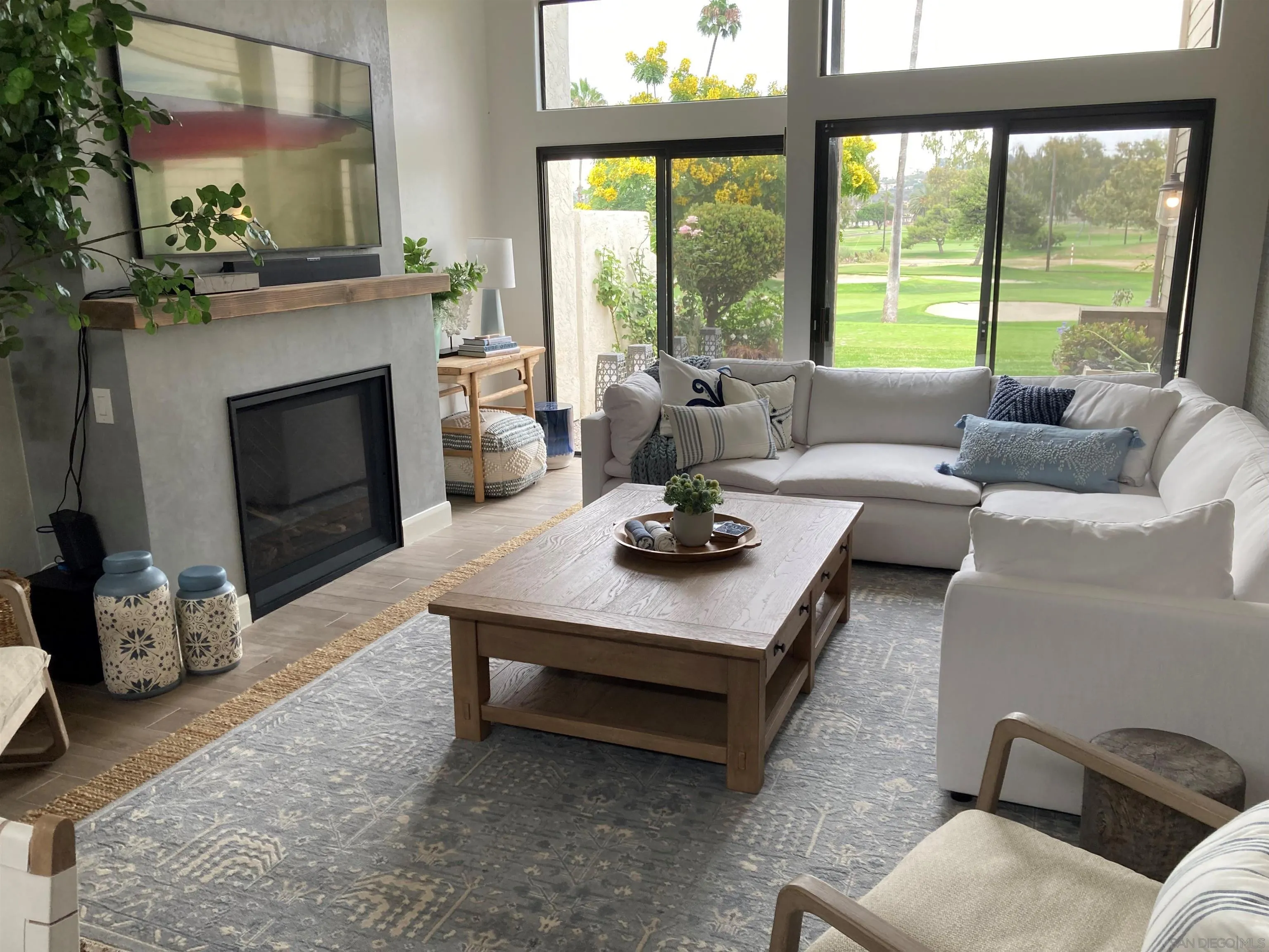 4023 Avenida Brisa Rancho Santa Fe, CA 92091 - Photo 5 of 24 a living room with furniture and a fireplace
