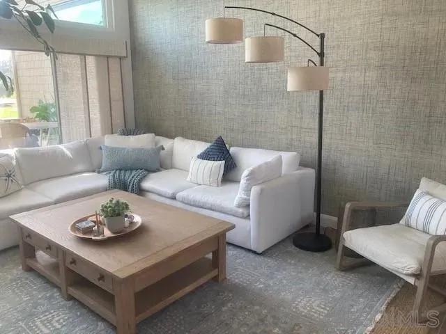 a living room with furniture and a table