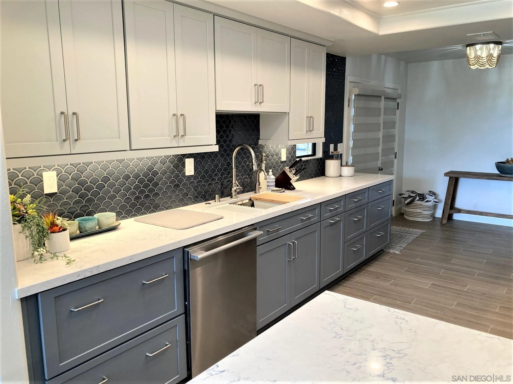 4023 Avenida Brisa Rancho Santa Fe, CA 92091 - Photo 9 of 24 a kitchen with stainless steel appliances granite countertop a sink a stove and cabinets