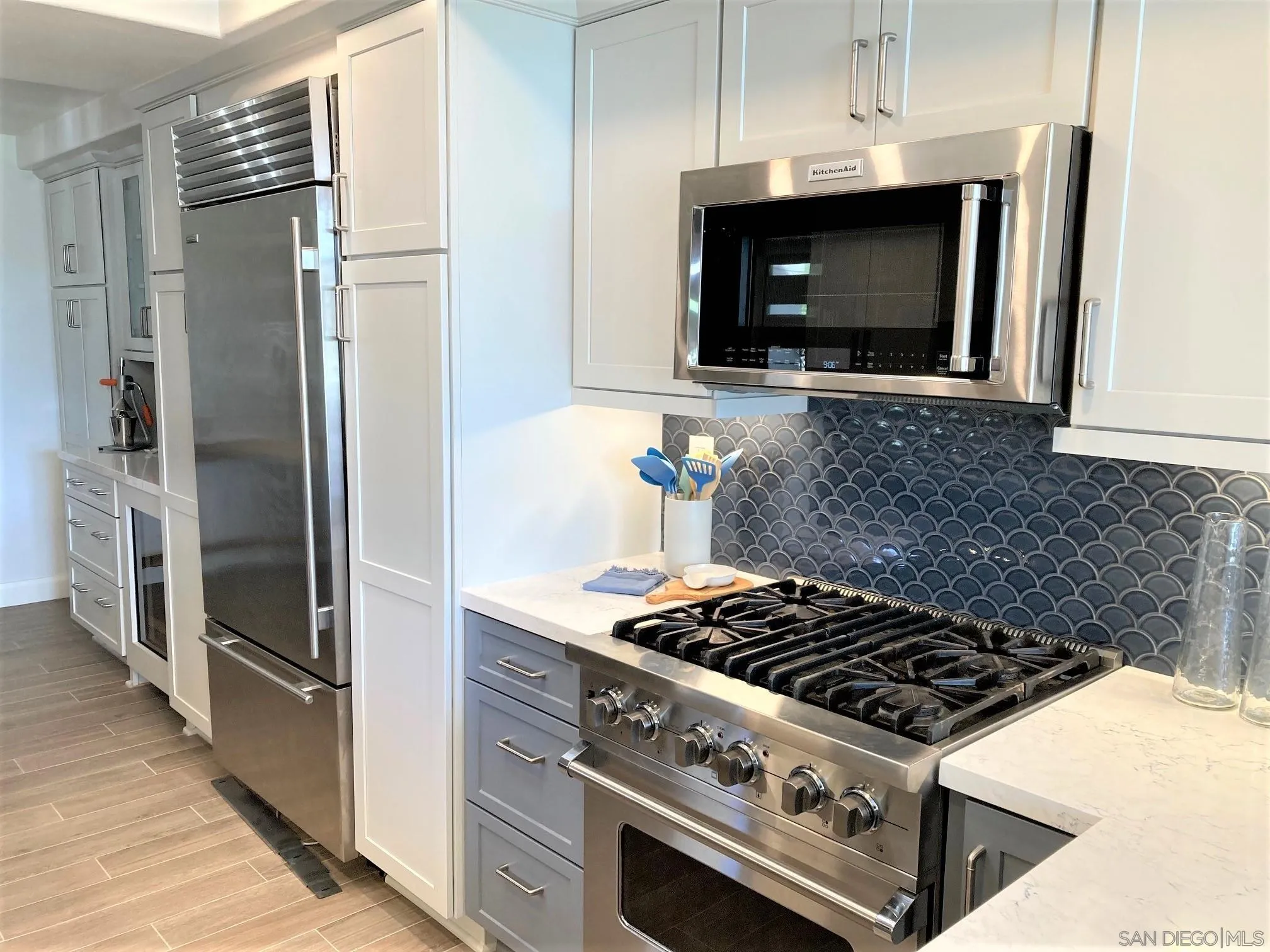4023 Avenida Brisa Rancho Santa Fe, CA 92091 - Photo 10 of 24 a kitchen with a stove and a microwave