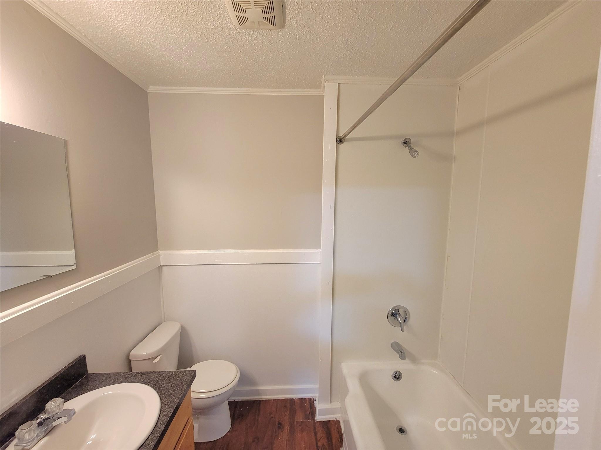 1203 Butler Street, Unit 1203D Gastonia, NC 28054 - Photo 5 of 5 a bathroom with a sink a toilet and bathtub