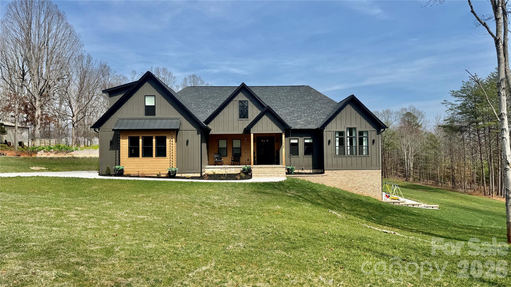 a front view of a house with a yard