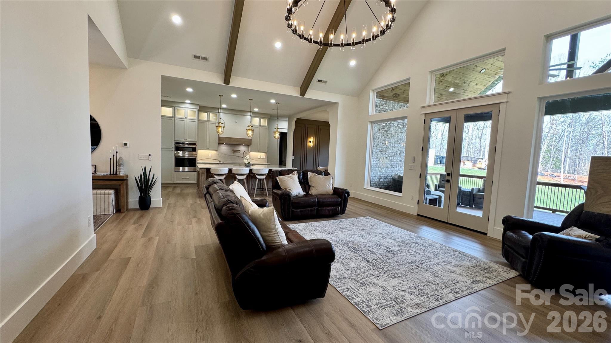 1360 Sain Road Hickory, NC 28602 - Photo 11 of 47 a living room with furniture a chandelier and a large window
