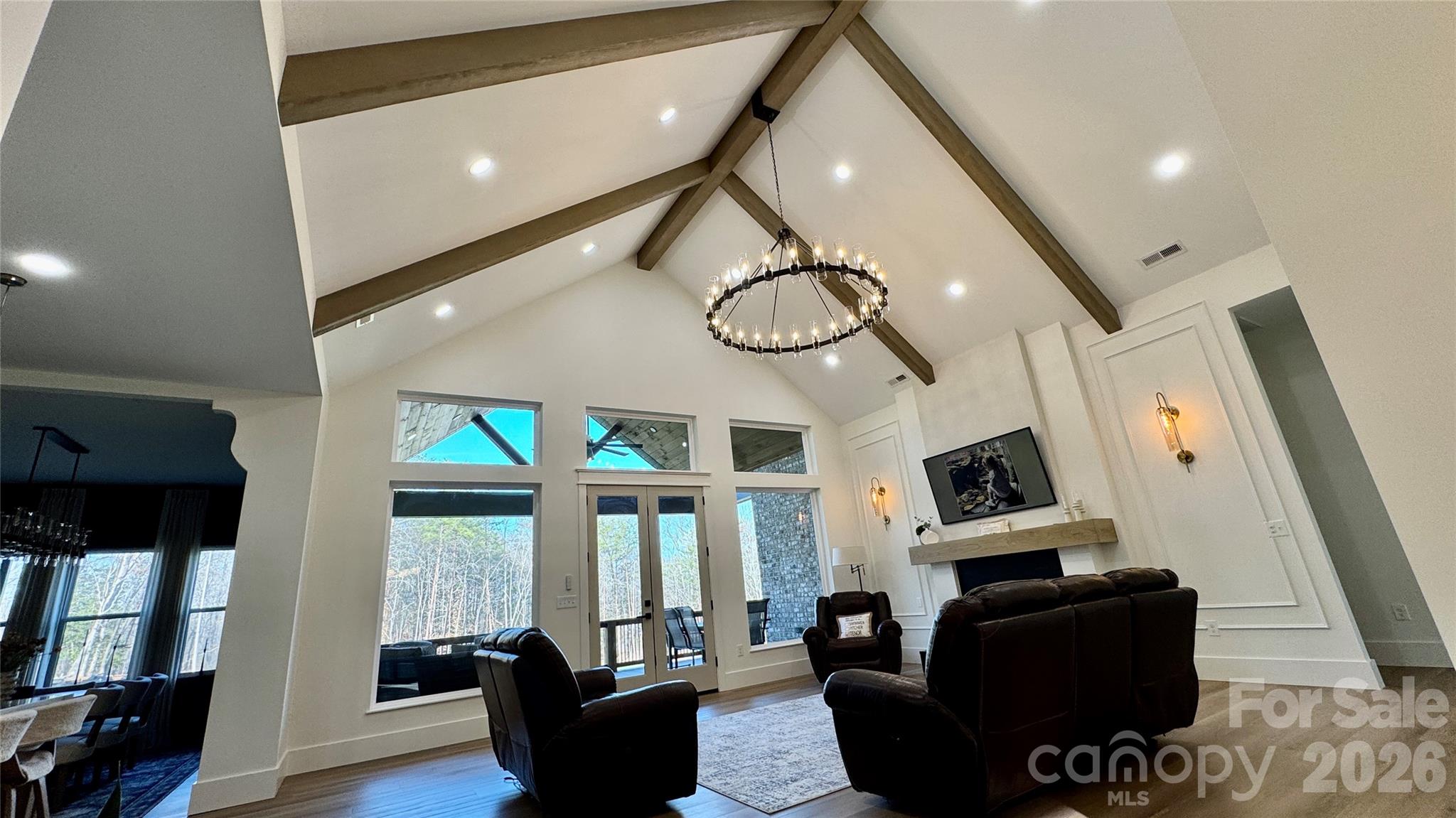 1360 Sain Road Hickory, NC 28602 - Photo 12 of 47 a living room with furniture a fireplace and a flat screen tv