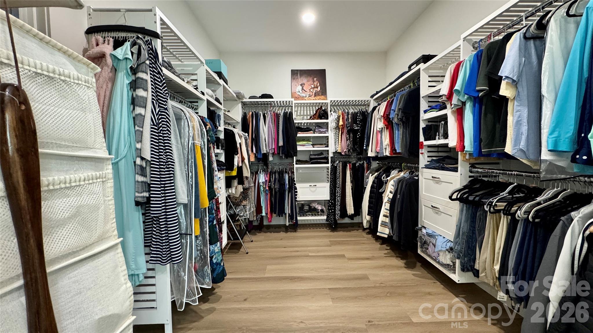 1360 Sain Road Hickory, NC 28602 - Photo 24 of 47 a view of walk in closet with clothes and shoes