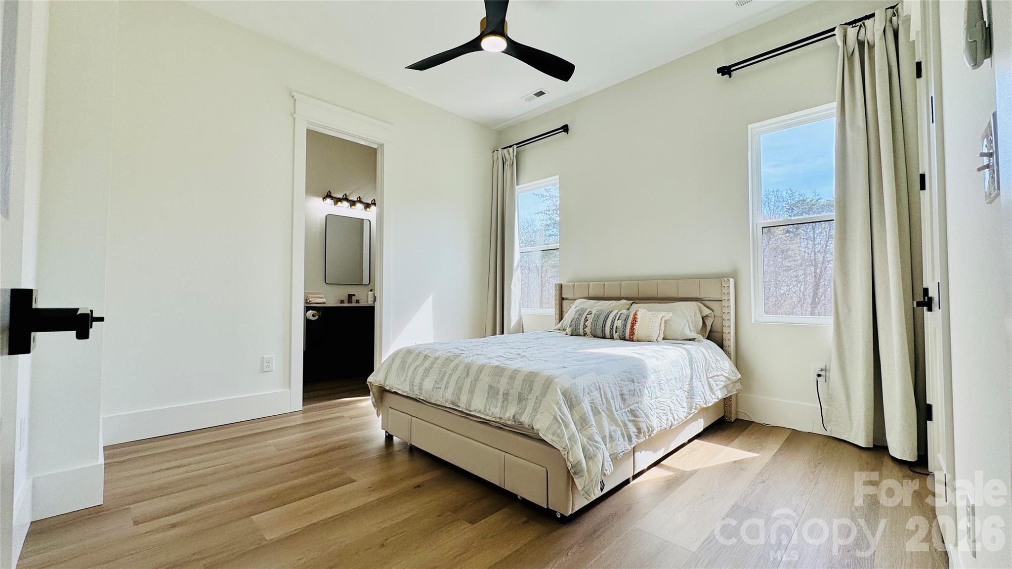 1360 Sain Road Hickory, NC 28602 - Photo 25 of 47 a bedroom with a bed closet and wooden floor