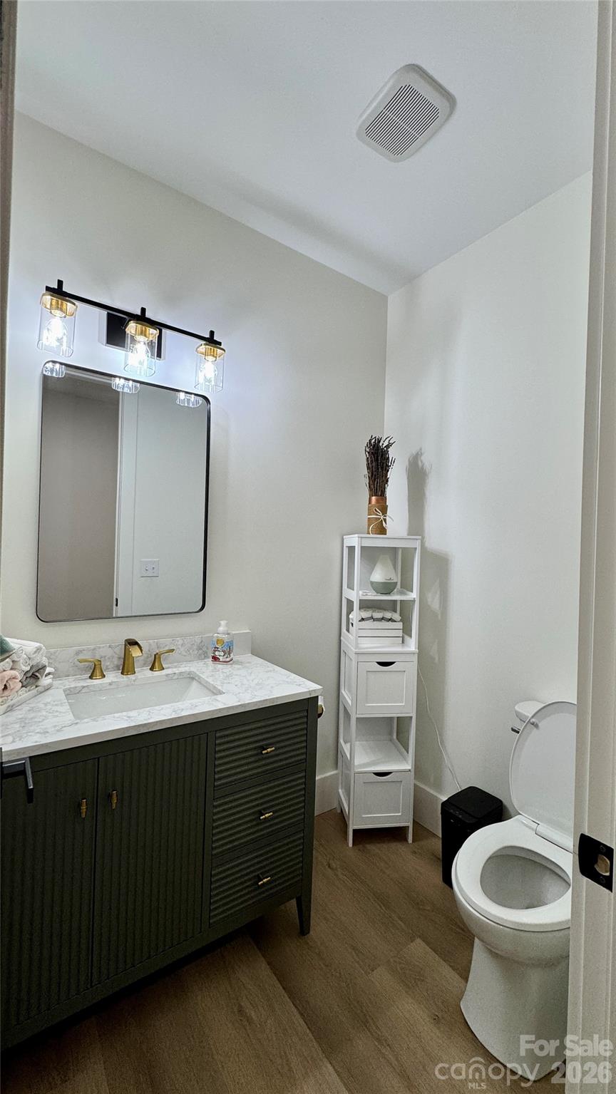 1360 Sain Road Hickory, NC 28602 - Photo 33 of 47 a bathroom with a double vanity sink toilet and mirror