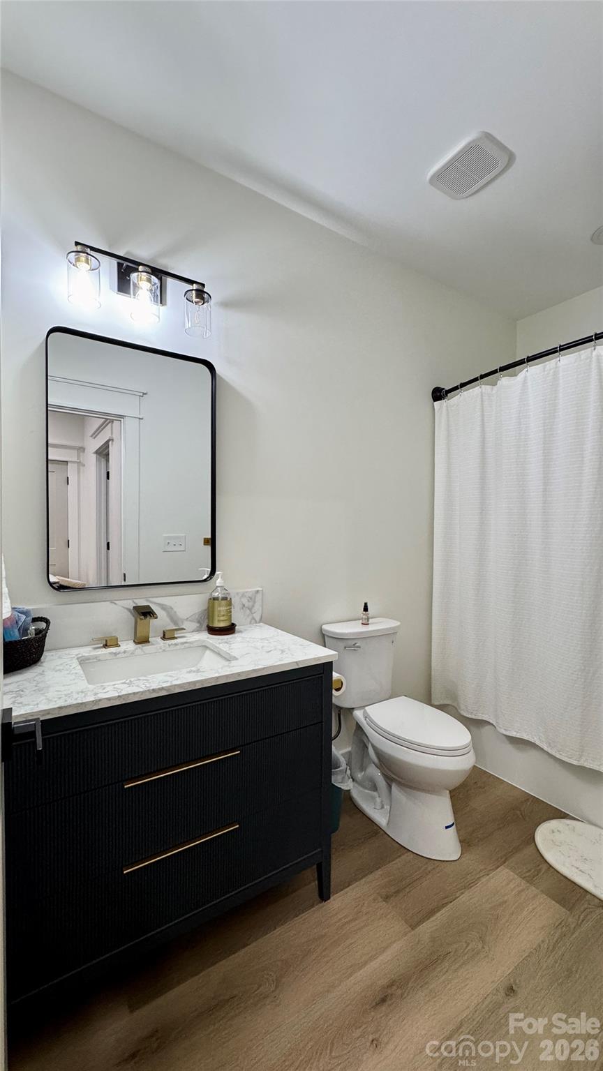 1360 Sain Road Hickory, NC 28602 - Photo 36 of 47 a bathroom with a toilet sink double vanity and mirror