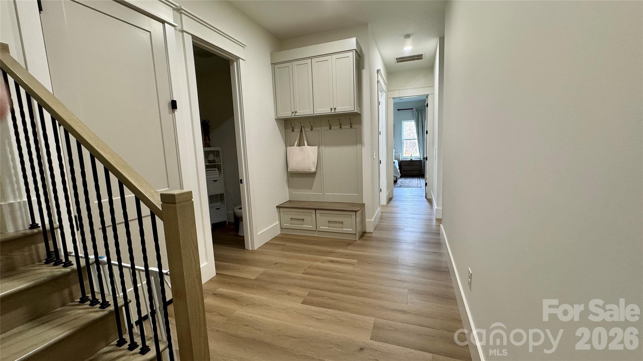 1360 Sain Road Hickory, NC 28602 - Photo 38 of 47 a view of a hallway view with wooden floor and staircase