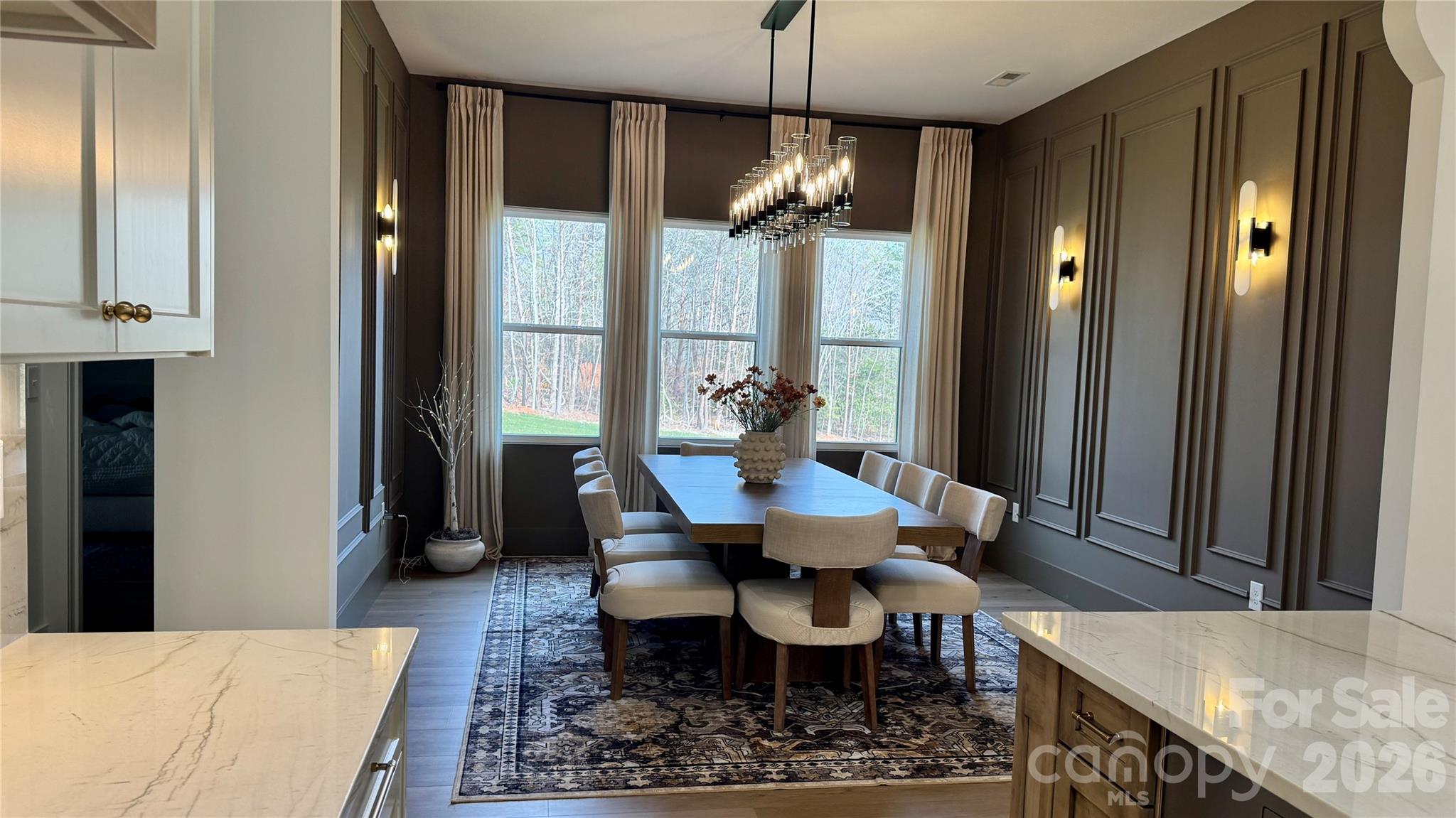 1360 Sain Road Hickory, NC 28602 - Photo 7 of 47 a dining room with furniture a chandelier and wooden floor