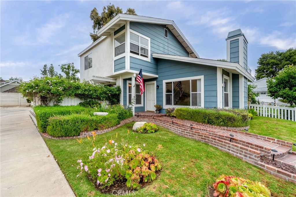 25 Sweet Rain Irvine, CA 92614 - Photo 1 of 45 a front view of a house with a yard