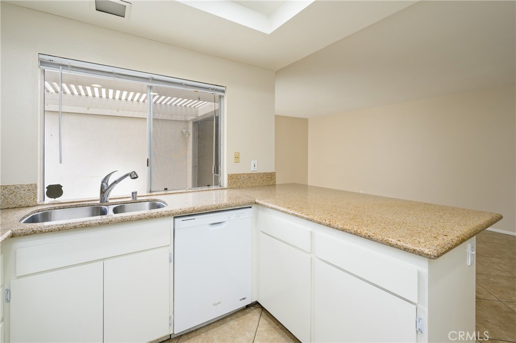 25 Sweet Rain Irvine, CA 92614 - Photo 12 of 45 a utility room with a sink and vanity