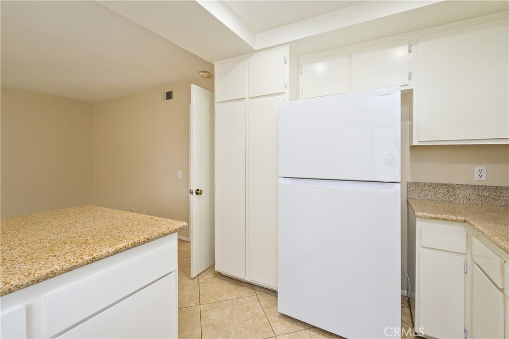 25 Sweet Rain Irvine, CA 92614 - Photo 13 of 45 a view of a kitchen with a refrigerator and a sink