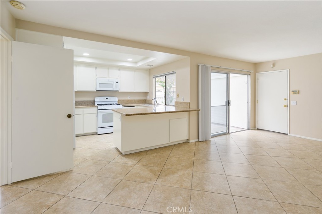 25 Sweet Rain Irvine, CA 92614 - Photo 14 of 45 a view of a kitchen with a sink cabinets and wooden floor