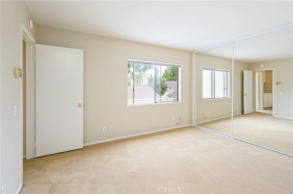 25 Sweet Rain Irvine, CA 92614 - Photo 23 of 45 an empty room with windows and closet