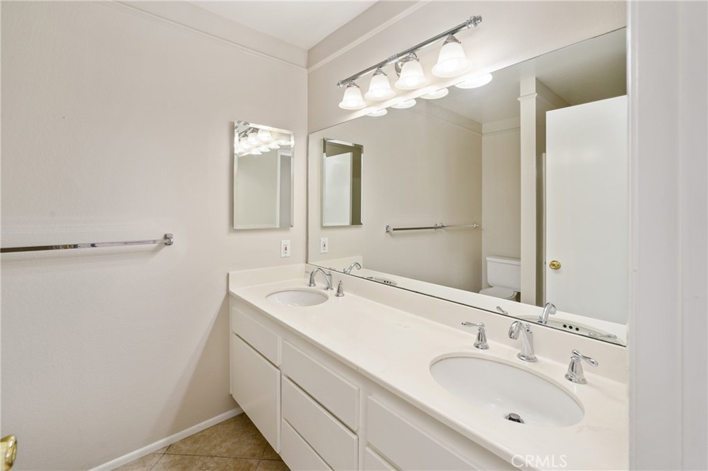 25 Sweet Rain Irvine, CA 92614 - Photo 25 of 45 a bathroom with a double vanity sink mirror and double
