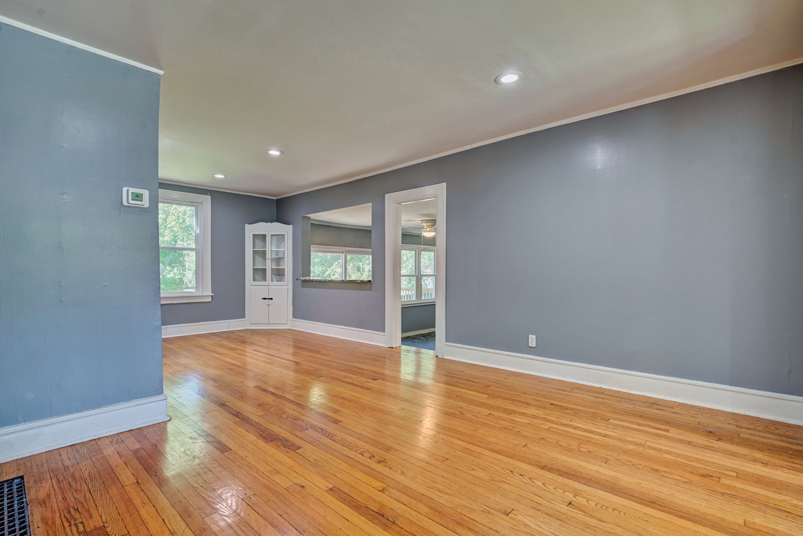 1643 Pine Road Homewood, IL 60430 - Photo 5 of 20 a view of an empty room with window and wooden floor