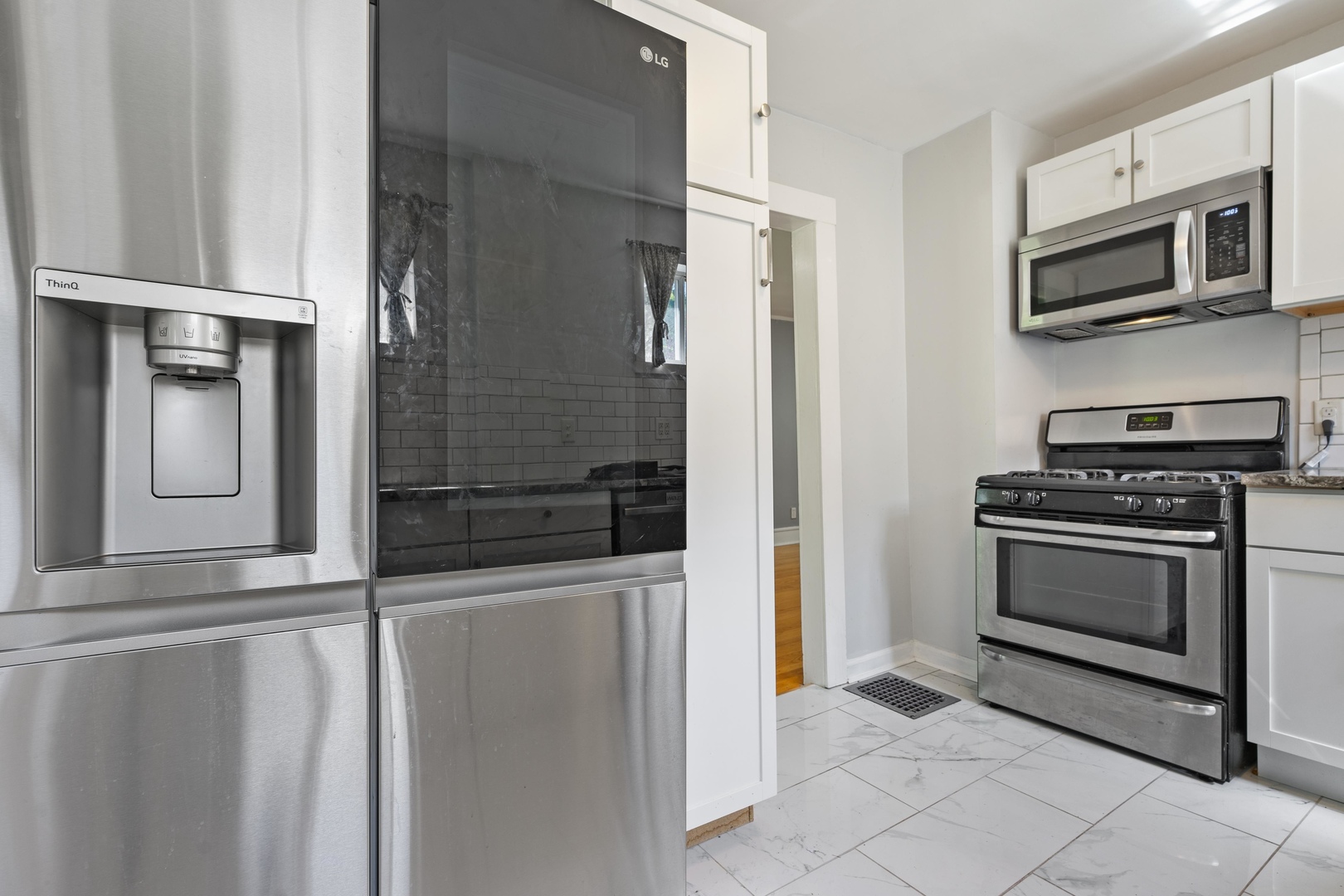 1643 Pine Road Homewood, IL 60430 - Photo 8 of 20 a kitchen with stainless steel appliances a refrigerator and a stove top oven