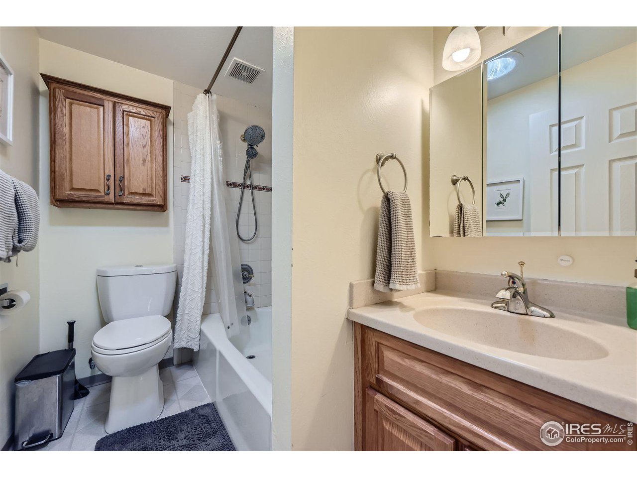 1175 Bear Mountain Drive, Unit A Boulder, CO 80305 - Photo 12 of 31 a bathroom with a sink toilet a mirror and shower