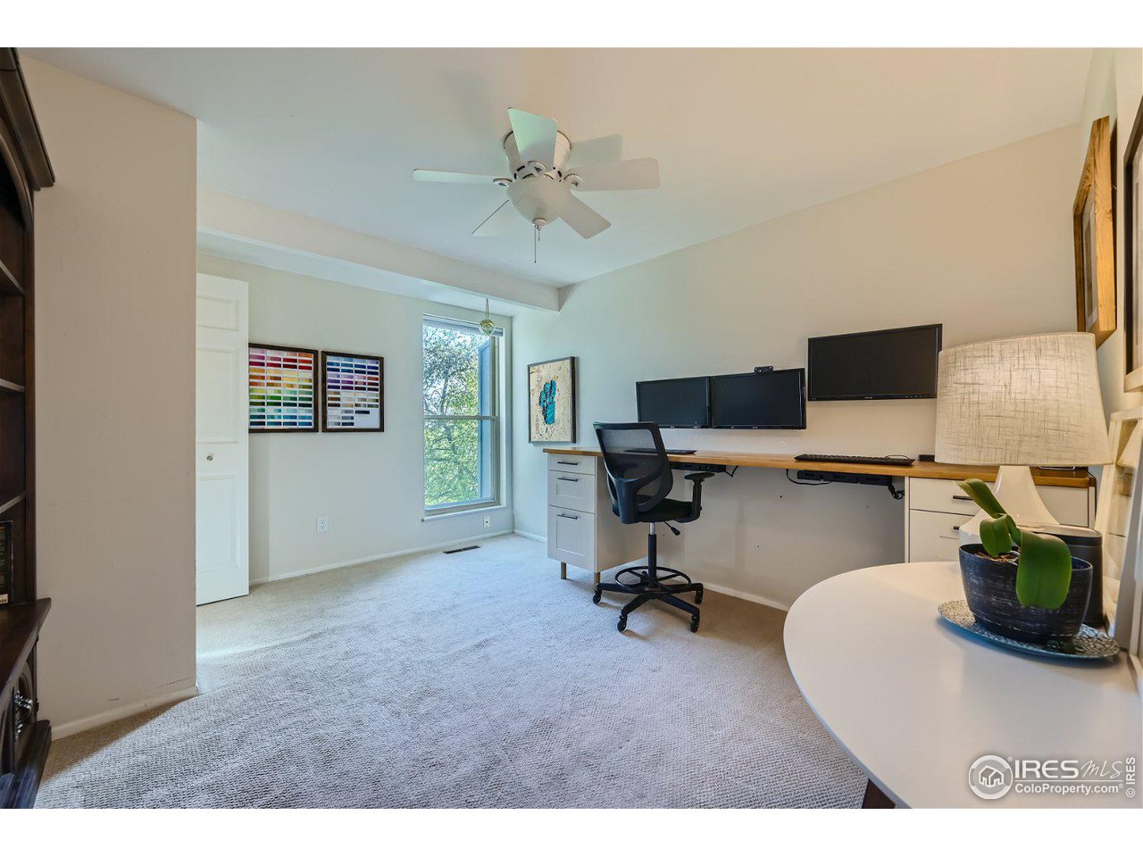 1175 Bear Mountain Drive, Unit A Boulder, CO 80305 - Photo 18 of 31 a living room with furniture and a flat screen tv