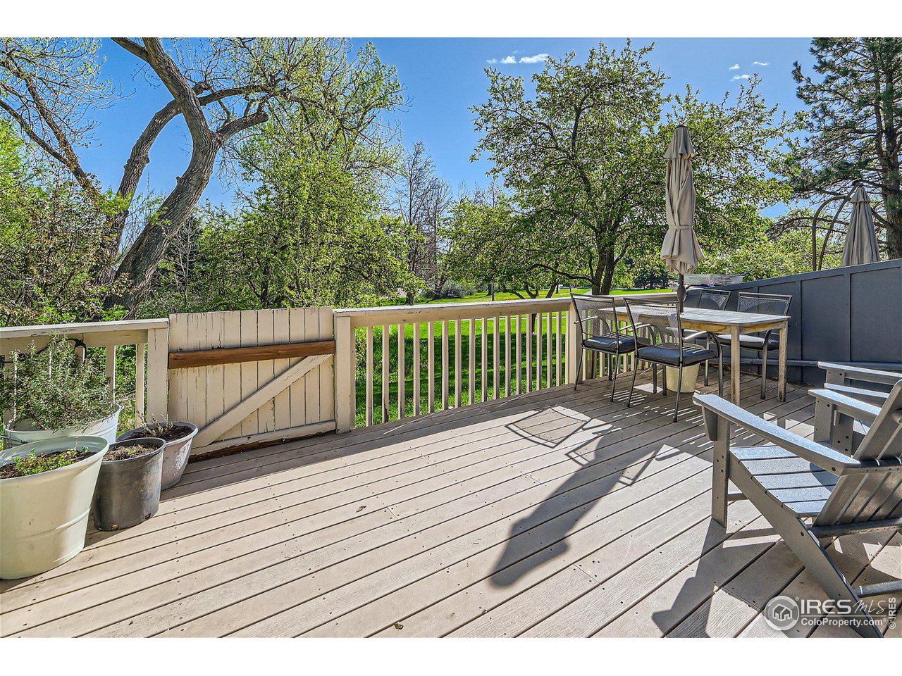 1175 Bear Mountain Drive, Unit A Boulder, CO 80305 - Photo 24 of 31 a view of a wooden deck with a patio