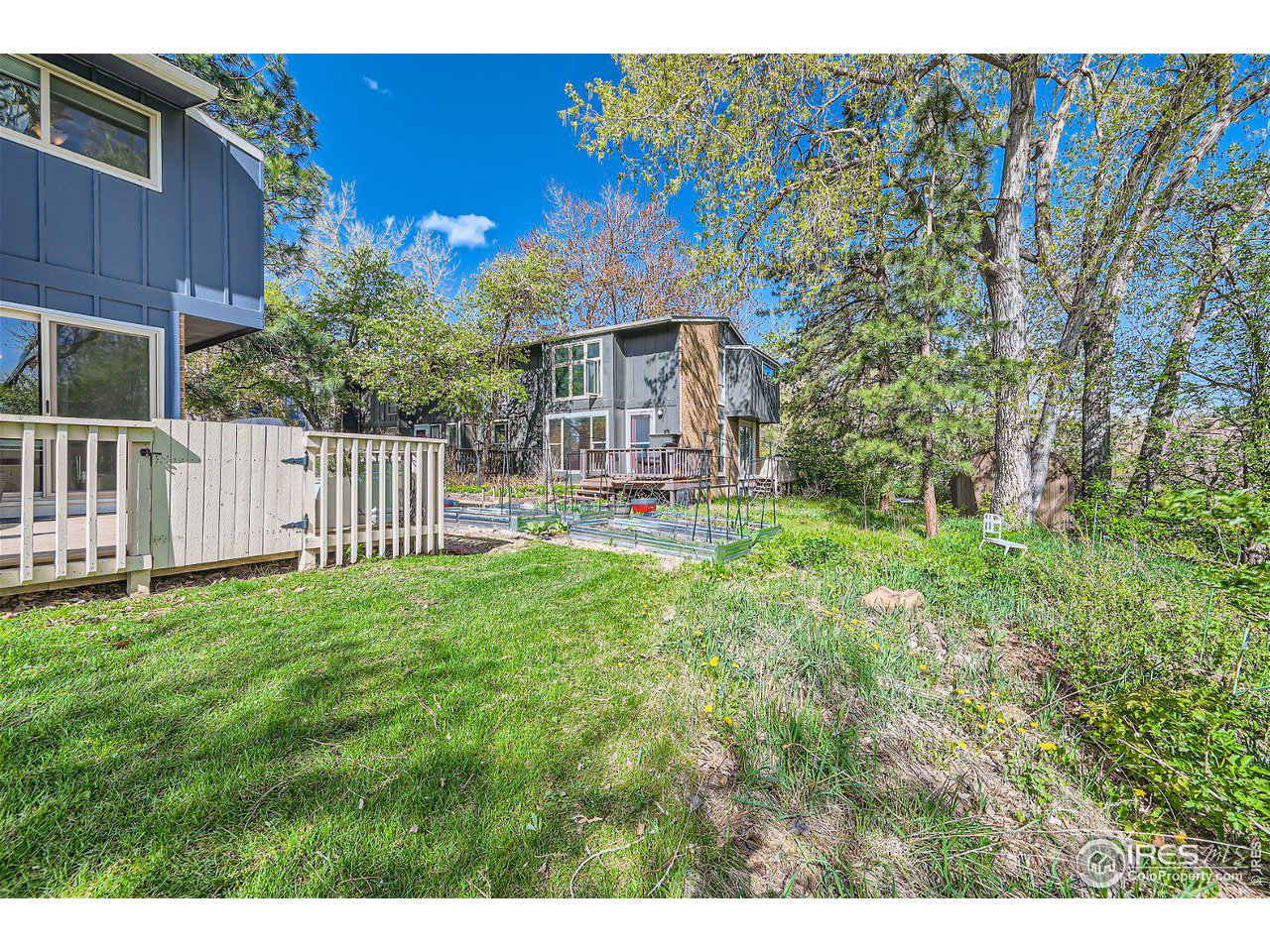 1175 Bear Mountain Drive, Unit A Boulder, CO 80305 - Photo 27 of 31 a view of a house with a yard