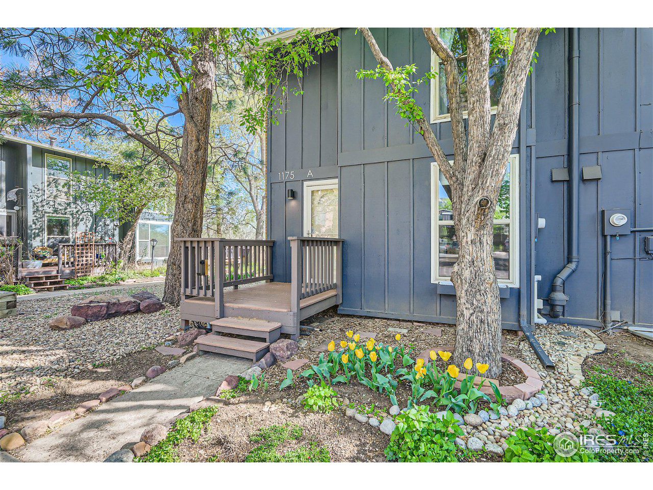 1175 Bear Mountain Drive, Unit A Boulder, CO 80305 - Photo 3 of 31 a view of a house with a backyard
