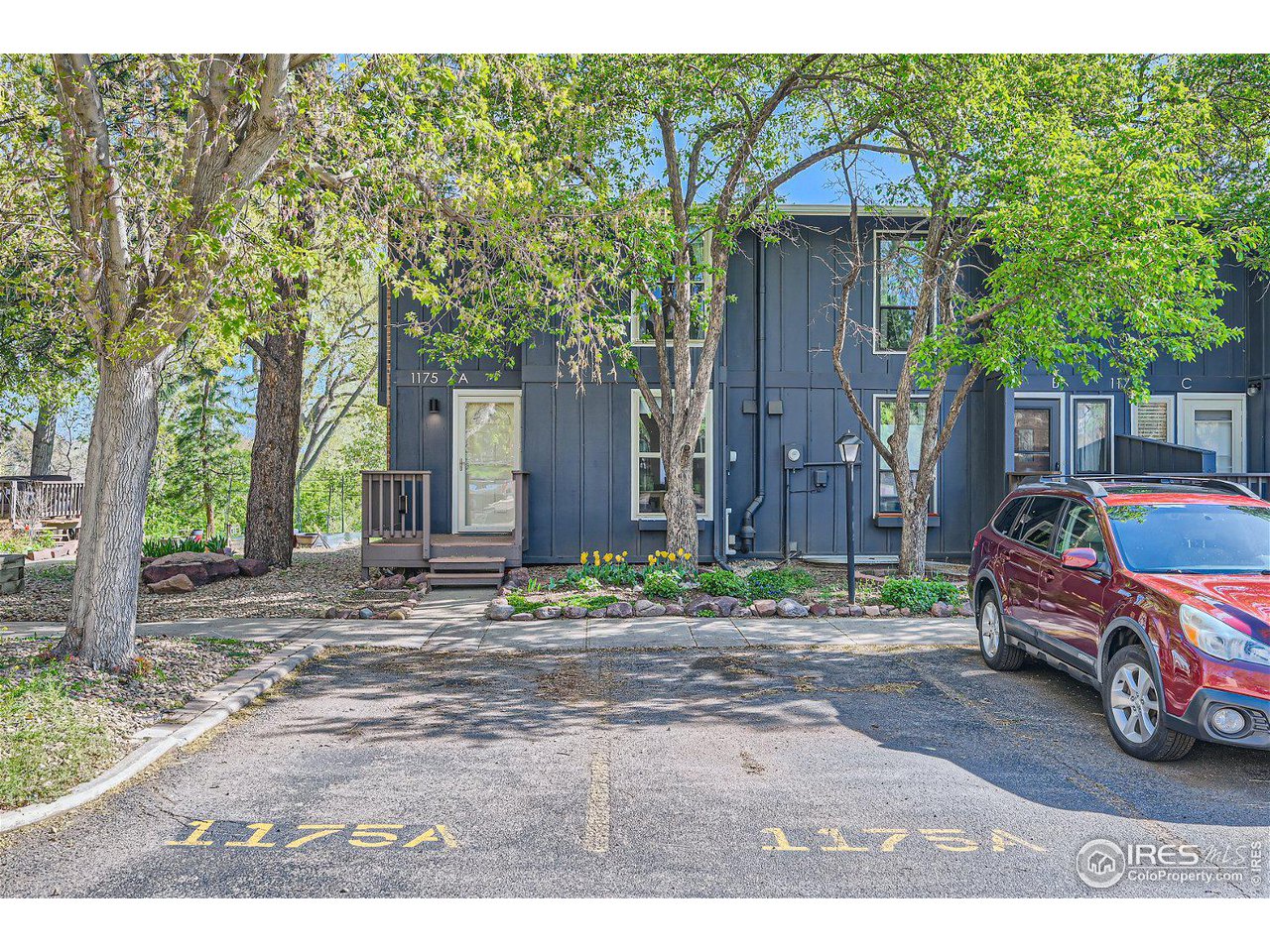 1175 Bear Mountain Drive, Unit A Boulder, CO 80305 - Photo 4 of 31 a backyard of a house with barbeque oven and outdoor seating