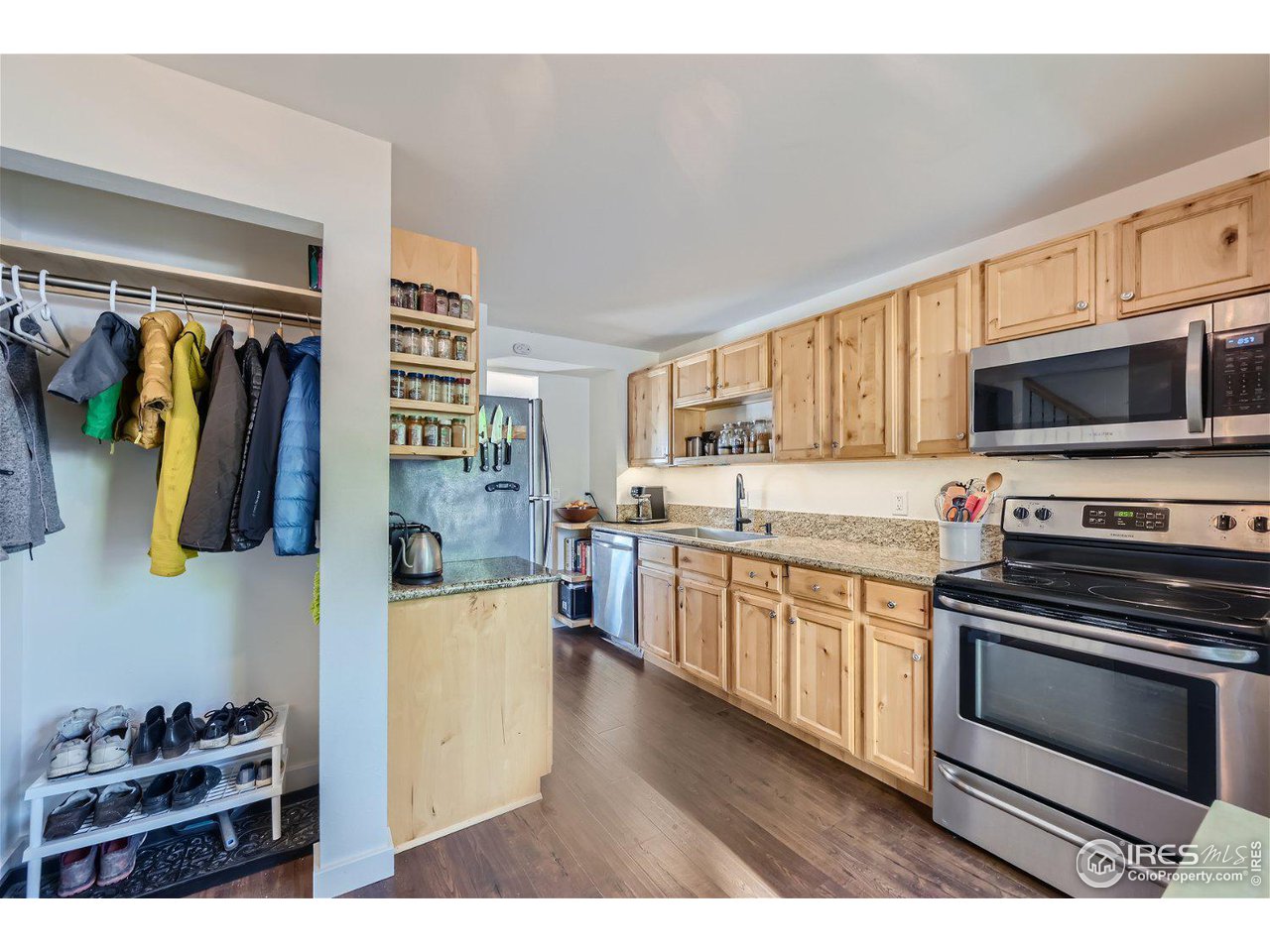 1175 Bear Mountain Drive, Unit A Boulder, CO 80305 - Photo 6 of 31 a kitchen with stainless steel appliances a stove microwave and cabinets