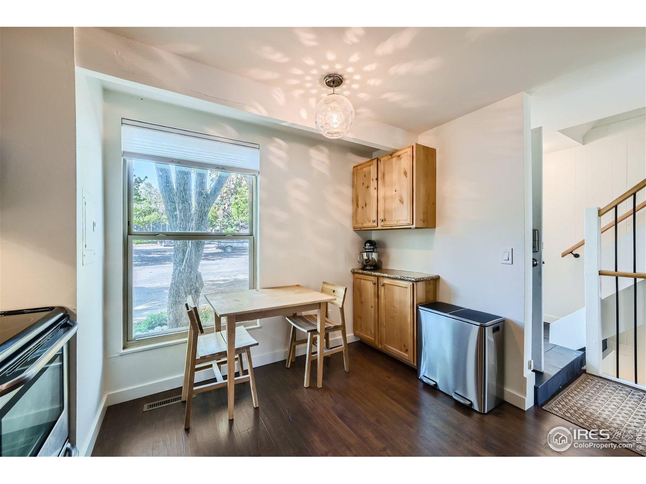 1175 Bear Mountain Drive, Unit A Boulder, CO 80305 - Photo 7 of 31 a view of a dining room with furniture window and wooden floor
