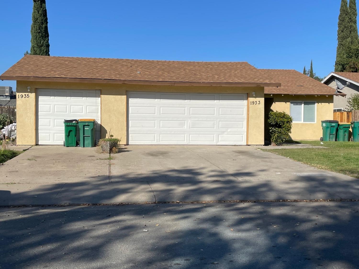 a view of a house with a street