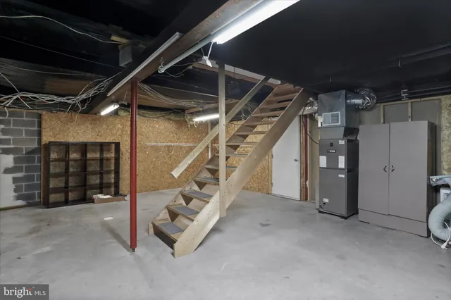 a view of an empty room with stairs