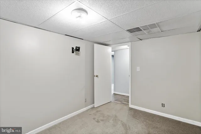 a view of a house with a snow in the background