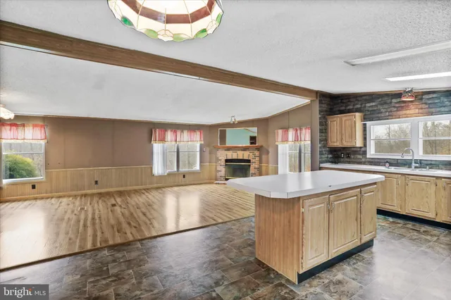 a kitchen with stainless steel appliances granite countertop a sink and cabinets