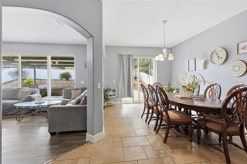 5047 Rishley Run Way Mount Dora, FL 32757 - Photo 13 of 42 a dining room with furniture and wooden floor