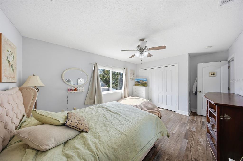 5047 Rishley Run Way Mount Dora, FL 32757 - Photo 24 of 42 a bedroom with a bed and window