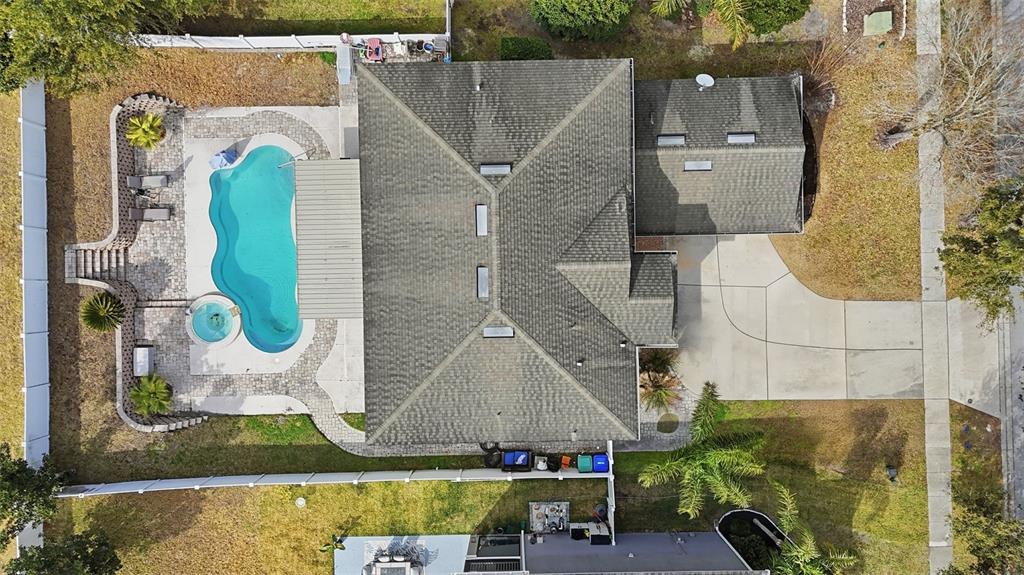 5047 Rishley Run Way Mount Dora, FL 32757 - Photo 32 of 42 an aerial view of a house with a swimming pool