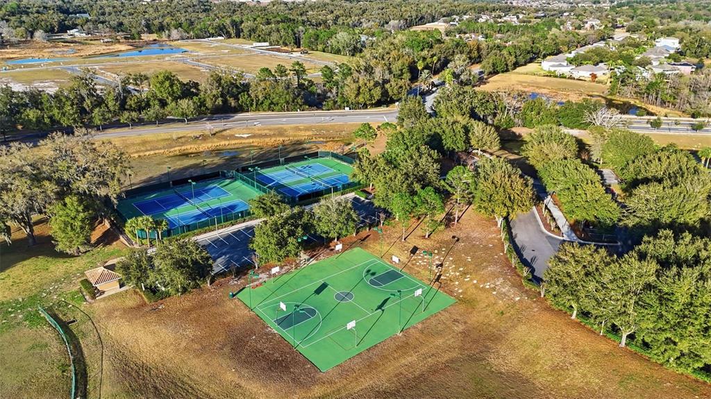 5047 Rishley Run Way Mount Dora, FL 32757 - Photo 38 of 42 an aerial view of a house with a yard basket ball court and outdoor seating
