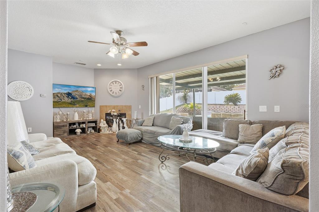 5047 Rishley Run Way Mount Dora, FL 32757 - Photo 6 of 42 a living room with furniture and a large window